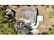 Aerial perspective of home showcasing roof, driveway, and outdoor features at 9377 Preston Rd, Brooksville, FL 34601