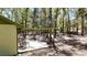 Relaxing back porch with outdoor seating, perfect for enjoying the serene, wooded backyard at 9377 Preston Rd, Brooksville, FL 34601