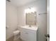 Bathroom with toilet and vanity with sink at 9377 Preston Rd, Brooksville, FL 34601