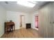 Bedroom with hard surface floors, desk, electric fireplace, and built in wardrobe at 9377 Preston Rd, Brooksville, FL 34601
