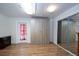 Spacious room with wood-look floors, closet space, and neutral tones, offering versatility for various interior styles at 9377 Preston Rd, Brooksville, FL 34601