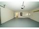 This is a spacious two car garage with painted floors and access to the house at 9377 Preston Rd, Brooksville, FL 34601