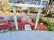 Charming garden view through a pergola adorned with decorative bicycle planter and lush foliage at 9377 Preston Rd, Brooksville, FL 34601