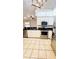 Kitchen showcasing stainless steel appliances, black countertops and bright lighting at 9377 Preston Rd, Brooksville, FL 34601