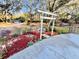 Close up of home's curb appeal, decorative garden feature and mature landscaping at 9377 Preston Rd, Brooksville, FL 34601