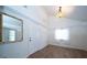 Living Room showing high ceilings, hard surface floors, light fixture, large window, and mirror at 9377 Preston Rd, Brooksville, FL 34601