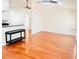 Living room with hardwood floors adjacent to an open kitchen design at 9377 Preston Rd, Brooksville, FL 34601