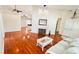 Bright living room featuring wood floors, fireplace and large windows with lots of natural light at 9377 Preston Rd, Brooksville, FL 34601
