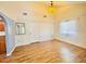Bright room with wood floors, high ceilings, and a view to the kitchen at 9377 Preston Rd, Brooksville, FL 34601