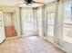 Bright sunroom featuring tile floors, lots of natural light, and a ceiling fan at 9377 Preston Rd, Brooksville, FL 34601