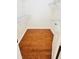 Empty walk-in closet with hardwood floors, wire shelving, and a wooden door at 9377 Preston Rd, Brooksville, FL 34601