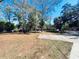 Grassy yard with large shade trees at 9377 Preston Rd, Brooksville, FL 34601