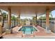 Outdoor hot tub with a covered seating area with surrounding landscape views at 10355 Paradise Blvd # 812, Treasure Island, FL 33706