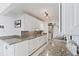 Kitchen with white cabinets and granite counters at 10355 Paradise Blvd # 812, Treasure Island, FL 33706