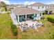 Aerial view of home with a large patio and screened-in lanai at 12503 Candleberry Cir, Tampa, FL 33635
