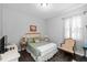Cozy bedroom with natural light, neutral walls, and a comfortable bed with decorative pillows at 12503 Candleberry Cir, Tampa, FL 33635