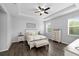 Bright primary bedroom with a ceiling fan, hardwood floors, and natural light and an expansive view at 12503 Candleberry Cir, Tampa, FL 33635