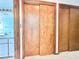 This closet features wood sliding doors and ample storage space at 13076 Kanawha Dr, Weeki Wachee, FL 34614