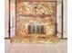 The focal point of the living room, a stone fireplace with a wooden mantel and decorative eagle at 13076 Kanawha Dr, Weeki Wachee, FL 34614