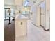 Kitchen with bright skylights, white appliances, and a breakfast bar overlooking the living area at 13076 Kanawha Dr, Weeki Wachee, FL 34614