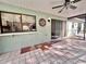 Covered patio features tile flooring, fan, window, and sliding glass doors offering indoor-outdoor living at 13076 Kanawha Dr, Weeki Wachee, FL 34614