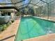 Large screened-in pool and outdoor patio area, ideal for enjoying the Florida sunshine at 13076 Kanawha Dr, Weeki Wachee, FL 34614