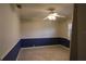 Bedroom with carpet flooring, ceiling fan, and two-tone walls at 16209 Belle Meade Blvd, Odessa, FL 33556