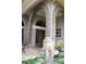 Detailed front entrance featuring a stone column, brick archway, and beautiful double doors at 16209 Belle Meade Blvd, Odessa, FL 33556