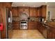 Well-appointed kitchen with stainless steel appliances and beautiful custom cabinetry at 16209 Belle Meade Blvd, Odessa, FL 33556