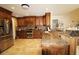 Modern kitchen with stainless steel appliances, custom cabinets, and granite countertops at 16209 Belle Meade Blvd, Odessa, FL 33556