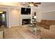 Comfortable living room with fireplace, built-in shelves, and cozy seating arrangement at 16209 Belle Meade Blvd, Odessa, FL 33556