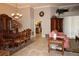Open-concept living and dining area with tile floors, elegant furniture, and natural light at 16209 Belle Meade Blvd, Odessa, FL 33556