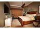 Spacious main bedroom with king bed, ceiling fan, and TV at 16209 Belle Meade Blvd, Odessa, FL 33556