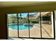 Relaxing outdoor pool area with a brick-paved patio and lush landscaping at 16209 Belle Meade Blvd, Odessa, FL 33556
