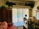 Bright living area with pool views through the sliding glass doors at 16209 Belle Meade Blvd, Odessa, FL 33556