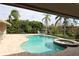 Inviting pool and spa area with lush landscaping and lounge chairs at 16209 Belle Meade Blvd, Odessa, FL 33556