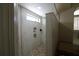 Modern shower with mosaic tile floor, a rain shower head, built-in shelving and bench seating at 16209 Belle Meade Blvd, Odessa, FL 33556