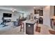Open concept living space with kitchen island flowing into the living room, great for entertaining at 16868 Scuba Crest St, Wimauma, FL 33598