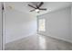 Bedroom featuring tile floors, a ceiling fan, and one window at 22442 Peachland Blvd, Port Charlotte, FL 33954