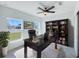 Serene home office with a large desk, natural light, and a view of the outdoors at 22442 Peachland Blvd, Port Charlotte, FL 33954