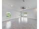 Spacious living room with tile floors, recessed lighting, and sliding glass doors at 22442 Peachland Blvd, Port Charlotte, FL 33954