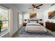 Bright and airy main bedroom featuring ample natural light and comfortable furnishings at 22442 Peachland Blvd, Port Charlotte, FL 33954