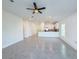 Open-concept living area featuring tile floors, kitchen island and bright open space at 22442 Peachland Blvd, Port Charlotte, FL 33954