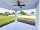 Covered patio featuring a ceiling fan and a view of the backyard at 22442 Peachland Blvd, Port Charlotte, FL 33954