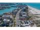 Charming coastal community with a mix of residential buildings, beach access, and local amenities along the waterfront at 240 108Th Ave # 102, Treasure Island, FL 33706