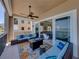 Enjoy outdoor living on this spacious balcony with comfortable seating and water view at 240 108Th Ave # 102, Treasure Island, FL 33706