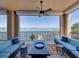 Relaxing balcony with comfortable seating and stunning waterfront views at 240 108Th Ave # 102, Treasure Island, FL 33706