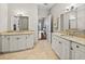 A spacious primary bath showcases dual sinks, marble countertops, and a serene atmosphere at 240 108Th Ave # 102, Treasure Island, FL 33706