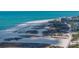 Scenic beachfront with crystal clear blue waters and soft sandy beach, perfect for relaxing and enjoying the coastal lifestyle at 240 108Th Ave # 102, Treasure Island, FL 33706