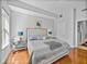 Bright, comfortable bedroom featuring a spacious layout and hardwood floors at 240 108Th Ave # 102, Treasure Island, FL 33706